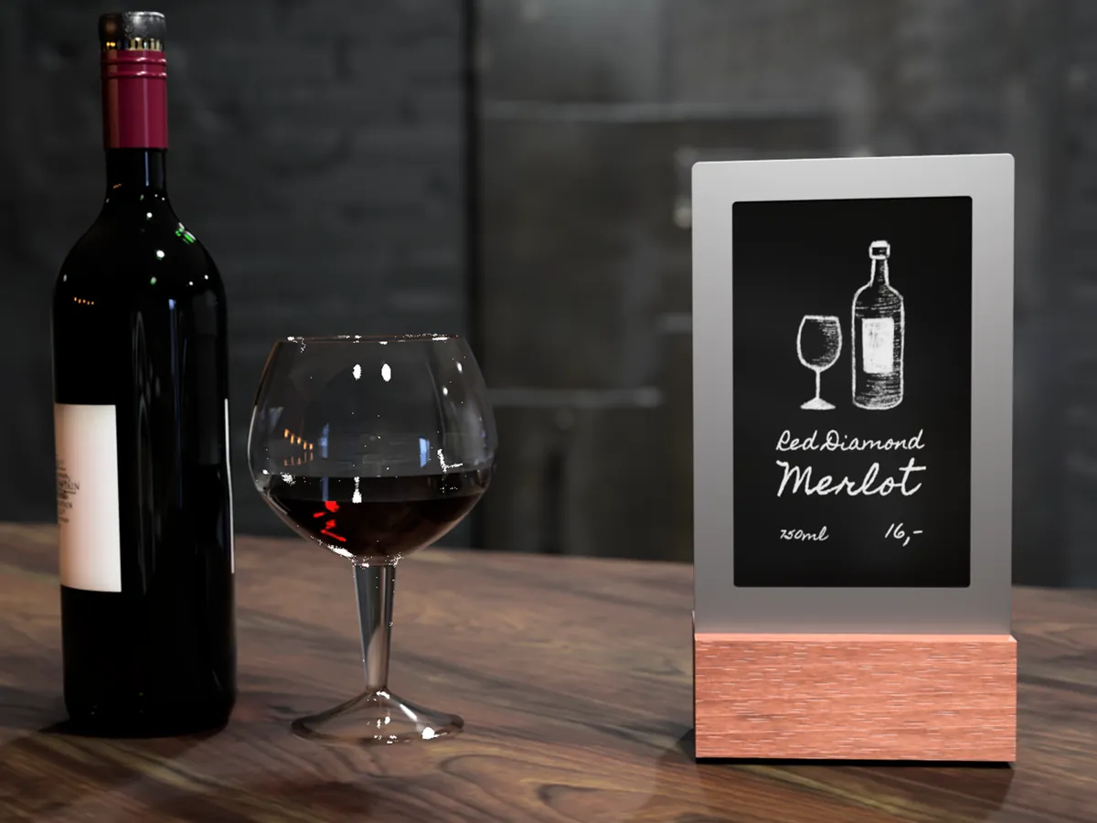 Diwa recommending a red wine next to a bottle and a glass